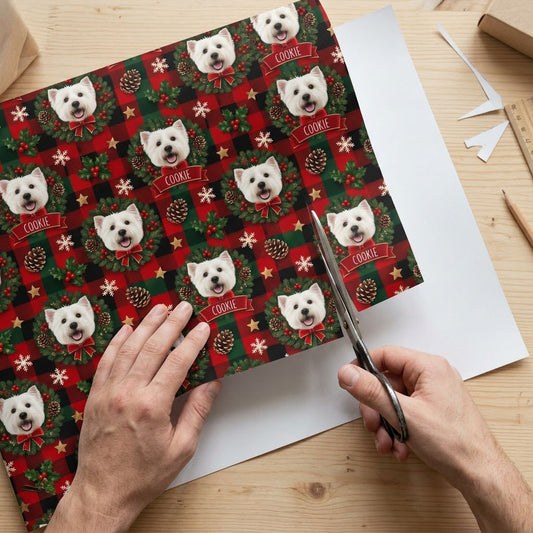 Red and green plaid wrapping paper with Westie in wreaths, snowflakes, stars, holly, and a name on red banners.