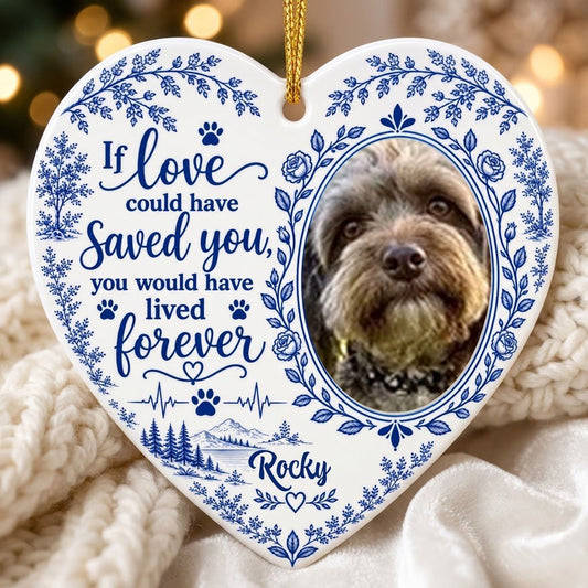 White heart ceramic ornament with blue dog photo frame wreath, memorial quote, paw heartbeat, and a mountain lake scene.