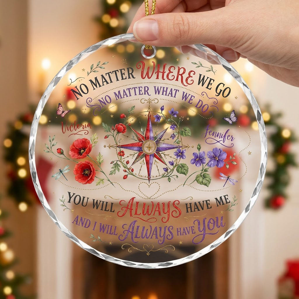 Round glass ornament with a compass rose, red and purple flowers, butterflies, dragonflies, and long-distance quotes.
