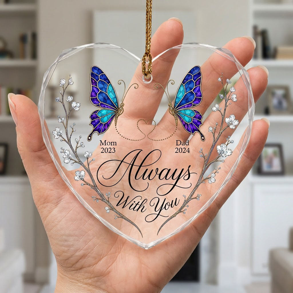 Heart-shaped glass ornament with stained-glass butterflies, gold dotted heart, and white-flower vines.