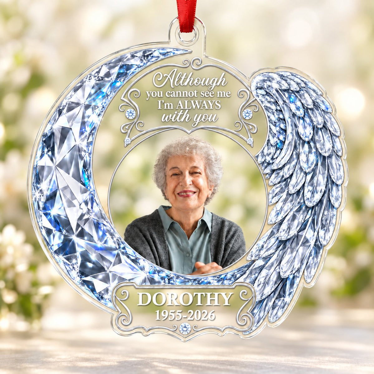 Acrylic ornament with blue crystal-look crescent moon, angel wing, circular photo frame and memorial quote.
