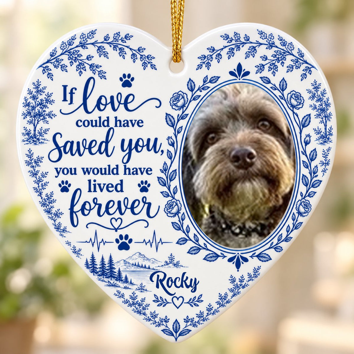 White heart ceramic ornament with blue dog photo frame wreath, memorial quote, paw heartbeat, and a mountain lake scene.