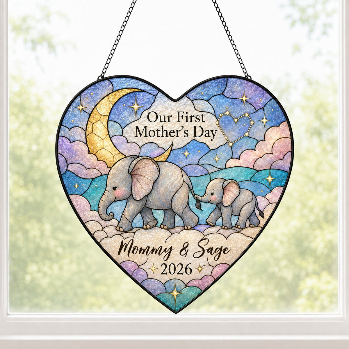 Heart stained-glass suncatcher with mom and baby elephants, crescent moon, pastel clouds, and gold stars.