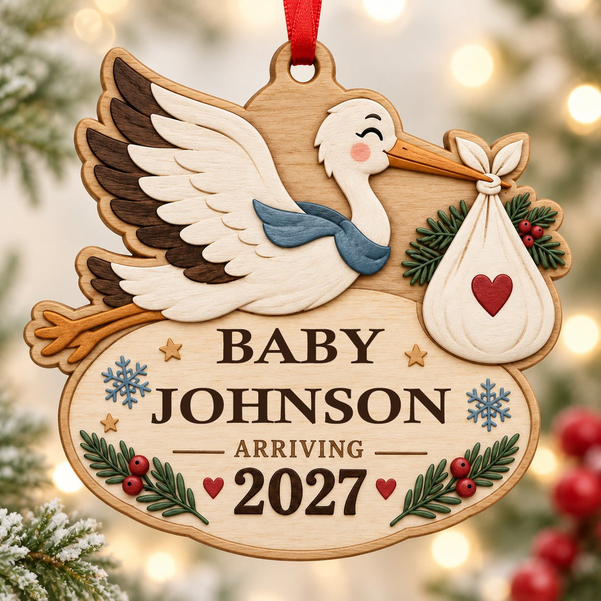 Custom-cut wood ornament of a flying stork with baby bundle above oval plaque reading BABY JOHNSON ARRIVING 2027.