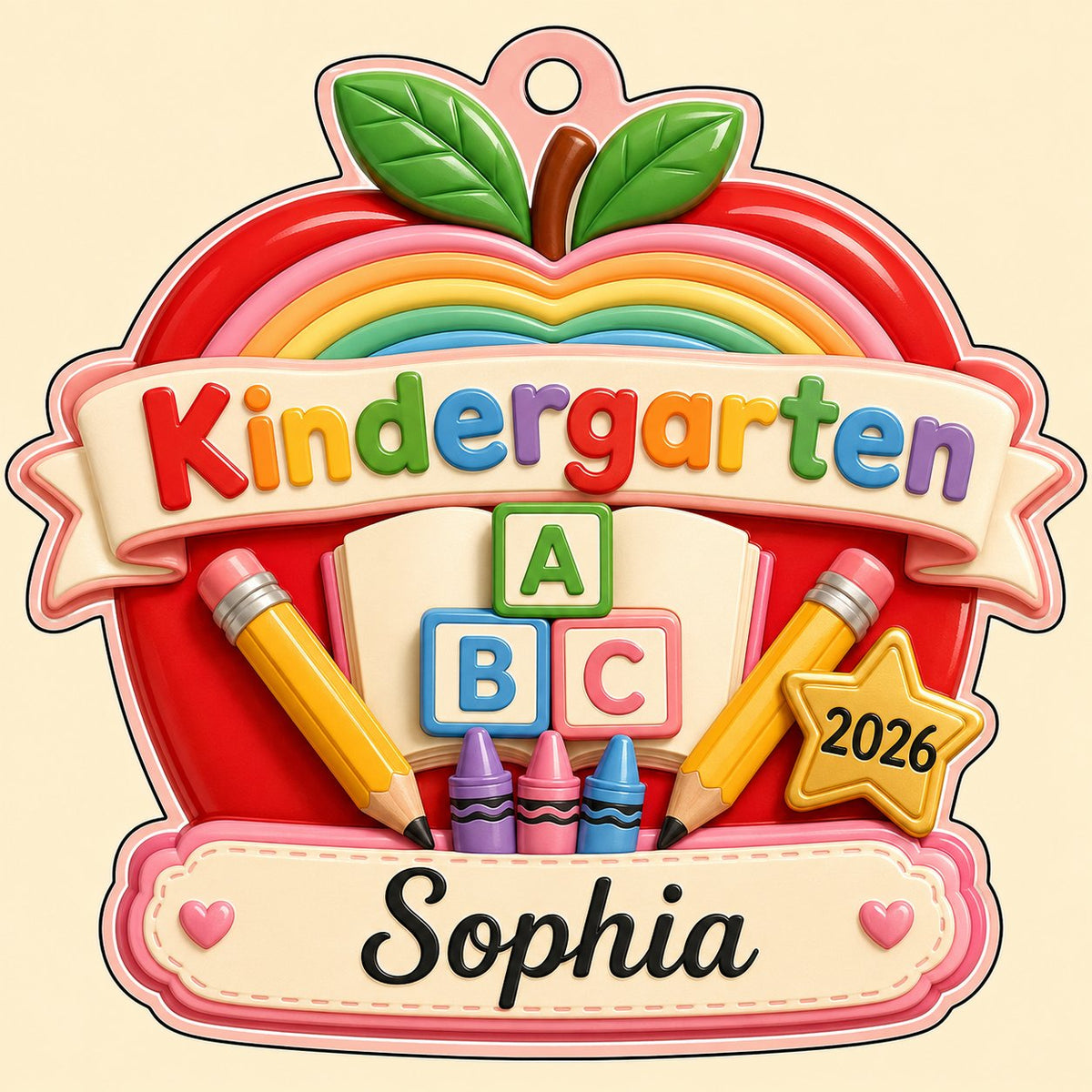 Red apple acrylic ornament with 'Kindergarten 2026', rainbow, ABC blocks, crayons, pencils, star badge, and a name banne