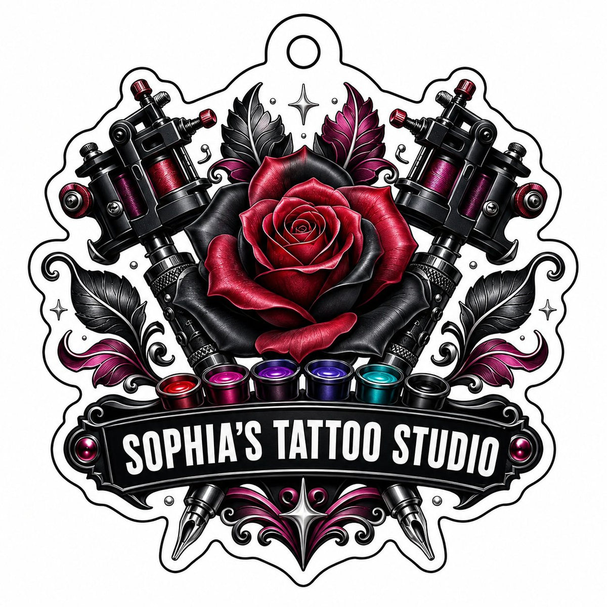 Clear acrylic ornament with red and black rose, crossed tattoo machines, caps, and SOPHIA'S TATTOO STUDIO text.