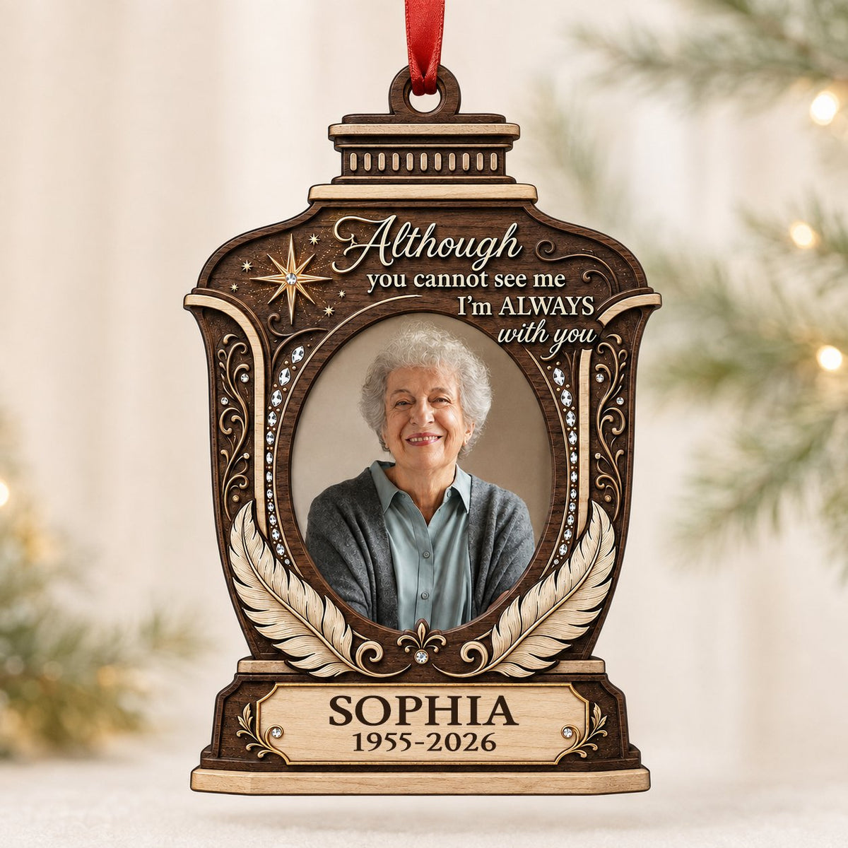 Lantern-shaped memorial wood ornament with oval photo, two feathers, starburst, fleur-de-lis and scrollwork accents.