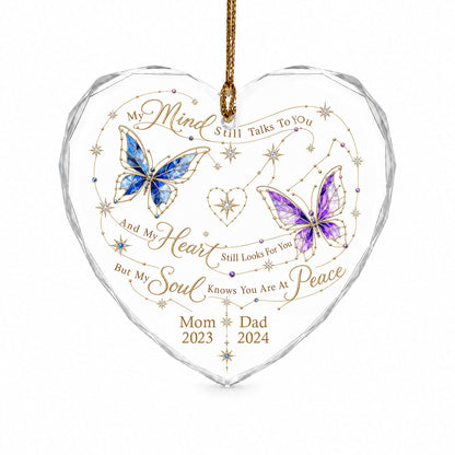 Heart-shaped glass ornament with blue and purple stained-glass butterflies, gold swirls, and memorial text.
