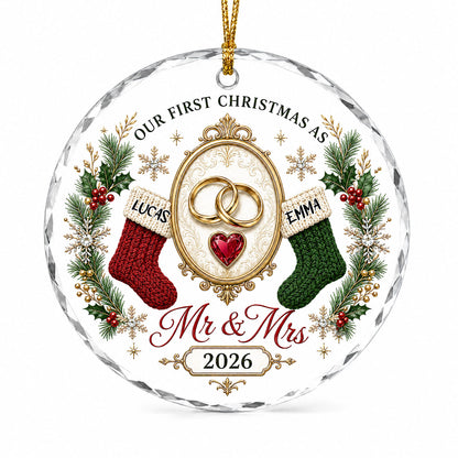 Round glass ornament with gold rings, red heart gem, red and green stockings, pine branches and Mr & Mrs text.