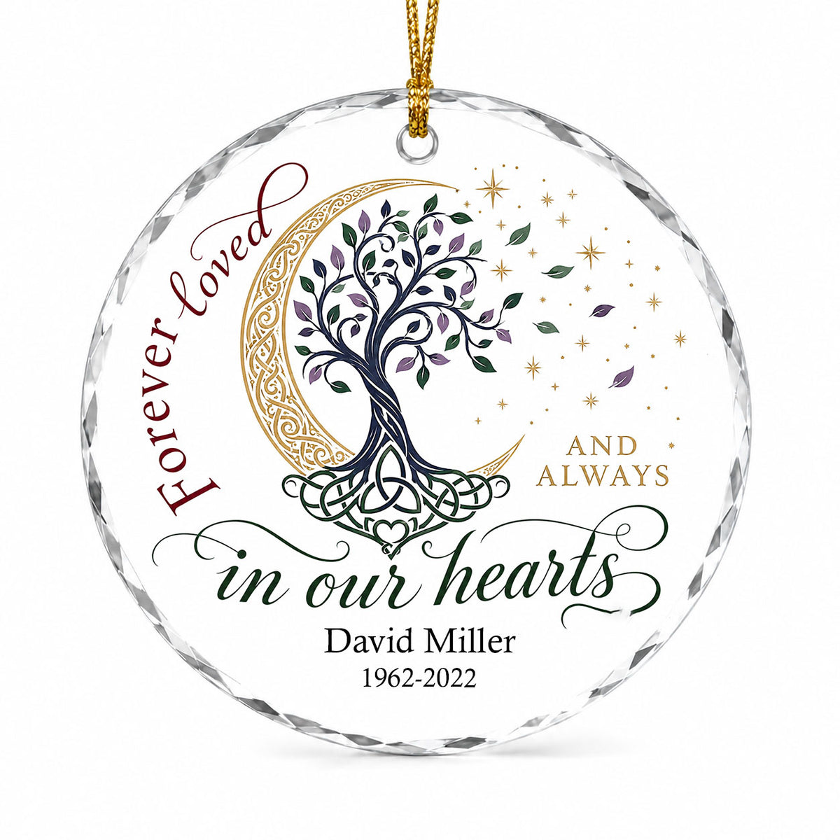 Round glass ornament with Celtic tree of life, gold crescent moon, stars, and phrase Forever loved in our hearts.