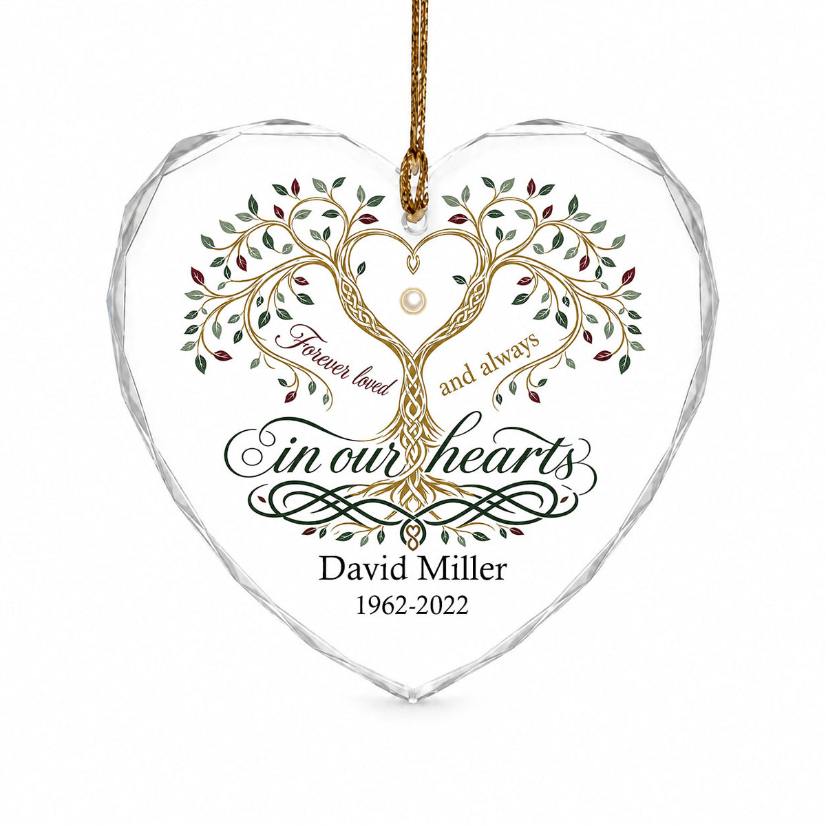 Heart glass ornament with a golden tree of life and the text 'Forever loved and always in our hearts'.