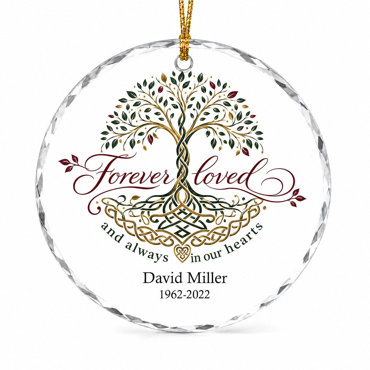 Round glass ornament with Celtic Tree of Life in green, gold and red, reading Forever loved and always in our hearts.