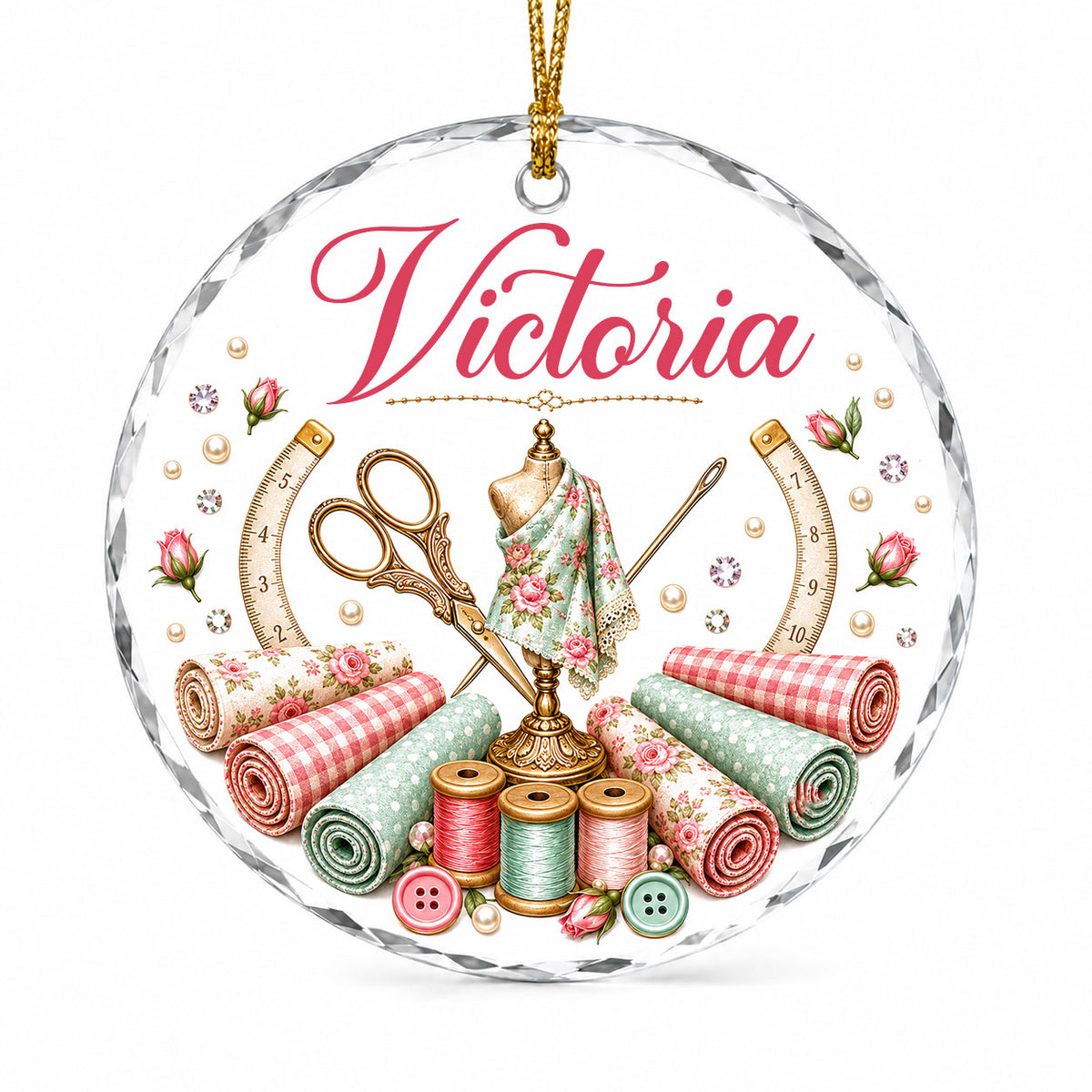 Round faceted glass ornament with a vintage dress form, sewing notions, and personalized name Victoria in pink and gold 