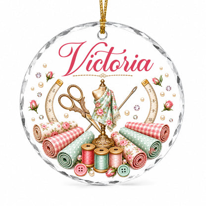 Round faceted glass ornament with a vintage dress form, sewing notions, and personalized name Victoria in pink and gold 