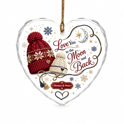 Heart glass ornament with red and cream pom-pom beanies, silver moon, gold star, and Love You Moon and Back text.
