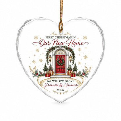 Heart-shaped glass ornament with a red front door, wreath, garland, lanterns, gift boxes, and gold snowflakes.