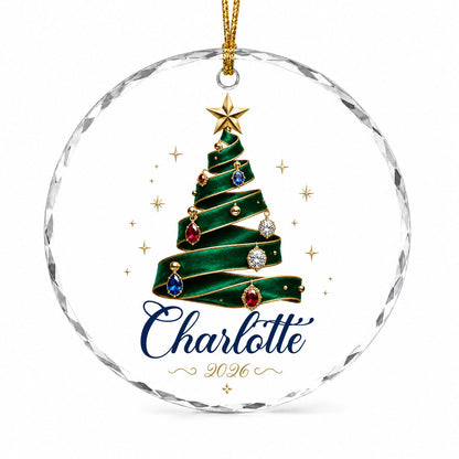 Round glass ornament with emerald ribbon tree, gold star and gem ornaments, personalized with name and year.