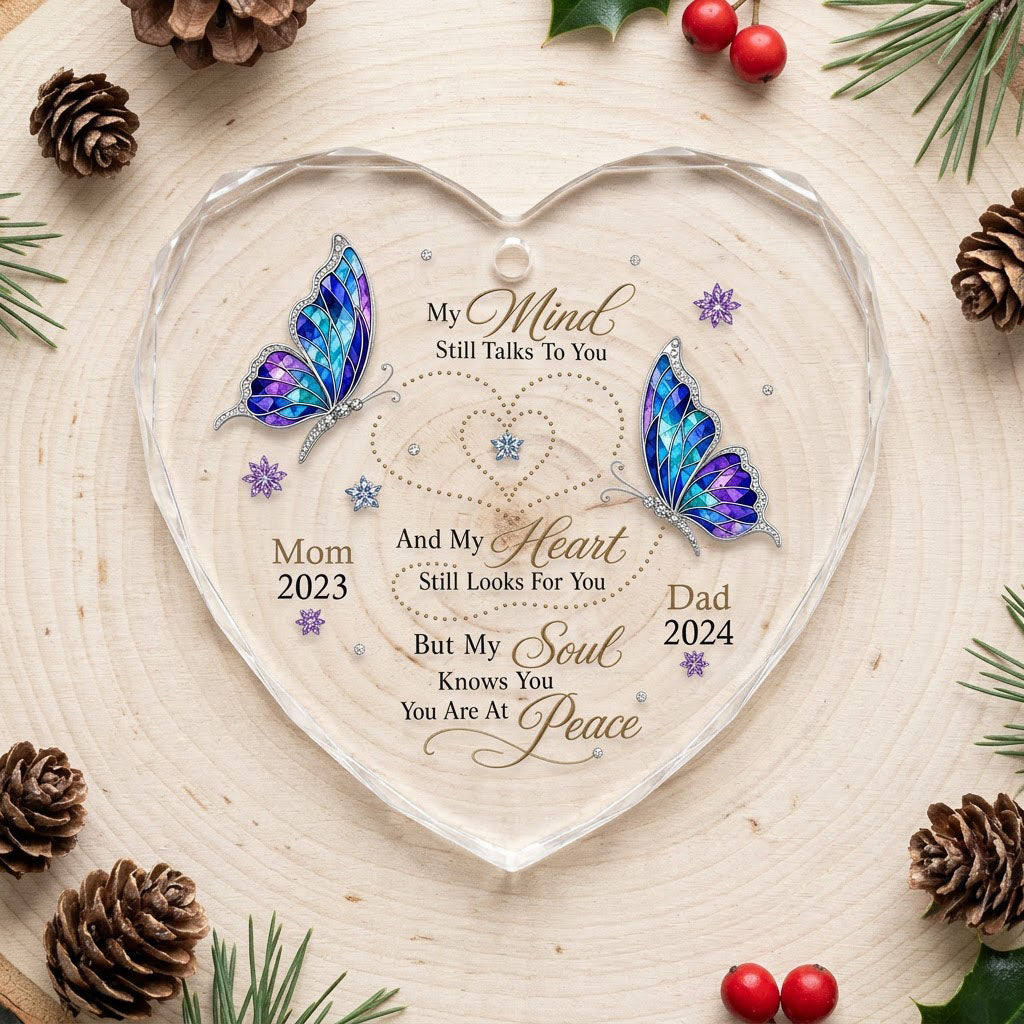 Heart glass ornament with two stained-glass butterflies, dotted heart trails, snowflakes, and a memorial quote.