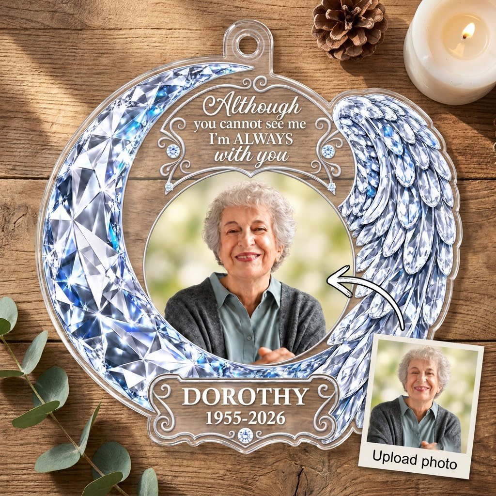 Acrylic ornament with blue crystal-look crescent moon, angel wing, circular photo frame and memorial quote.