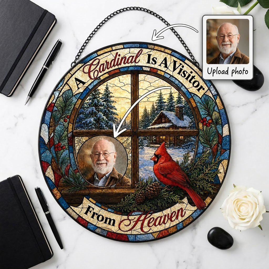 Stained glass suncatcher with a wooden four-pane window, snowy cabin scene, red cardinal on pine branches, and a circula