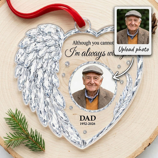 Clear acrylic heart ornament with crystal wing on the left, diamond accents, and a central circular photo frame.