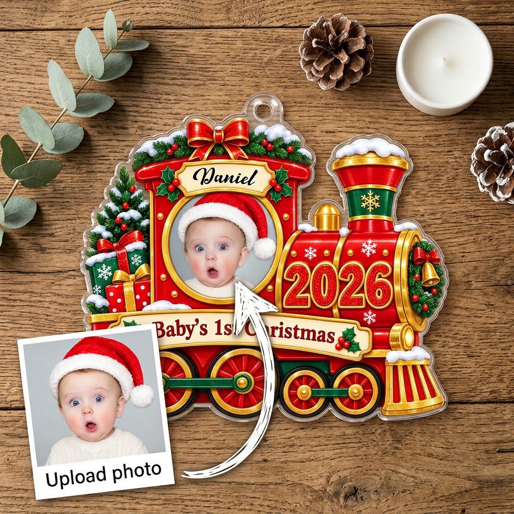 Red and gold train ornament with circular baby photo, bow, holly, wreath and 'Baby's 1st Christmas' on a scroll banner.
