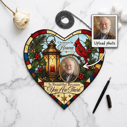 Heart stained glass suncatcher with lantern, red candle, red cardinal, holly, pine, and an oval photo frame.