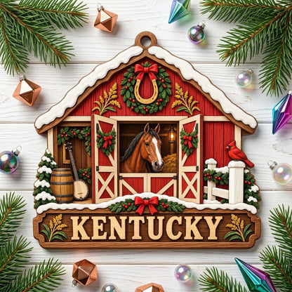 Snow-topped red barn ornament with brown horse, horseshoe wreath, wheat, and “KENTUCKY” text on a barn silhouette.