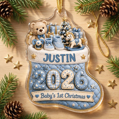 Blue quilted stocking ornament with teddy bear, baby toys, Baby's 1st Christmas text, and name and year.