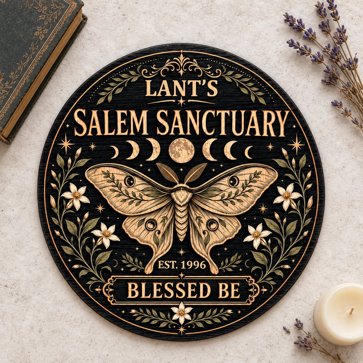 Round wooden sign with a central moth, moon phases, floral vines, stars, and 'Salem Sanctuary' 'Blessed Be' text.