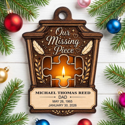 Wood ornament with lantern-style frame, puzzle-piece cutout revealing candle glow, “Our Missing Piece” text and feather 