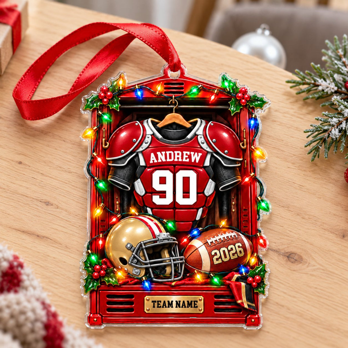 Acrylic ornament with a red football locker, jersey on hanger, gold helmet, brown football and gold plaque
