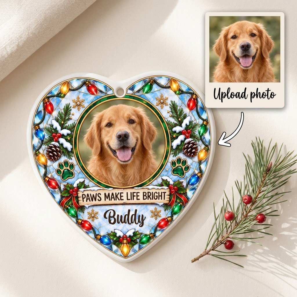 Heart ceramic ornament with dog photo frame, “PAWS MAKE LIFE BRIGHT”, lights, pine branches, paw prints, and red ribbon 