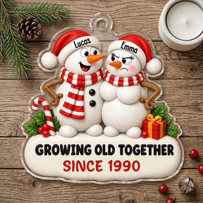 Custom-cut acrylic ornament of a snowman couple with candy cane, gift box, and Growing Old Together text on a snowy base