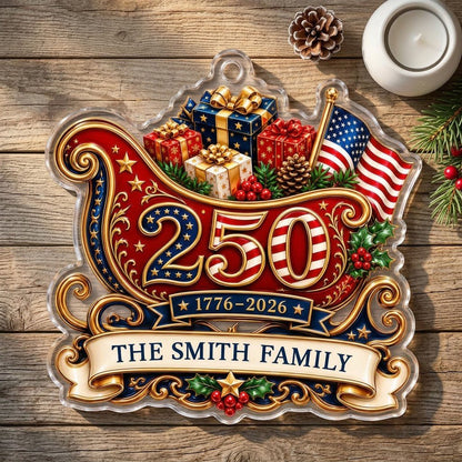 Acrylic ornament shaped like a Santa sleigh with '250', '1776-2026', US flag and a family name banner.