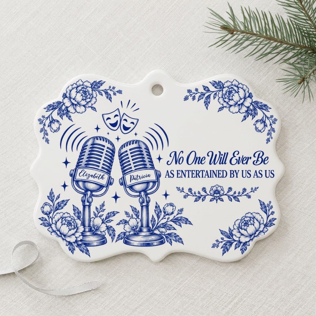 White ceramic ornament with cobalt blue vintage microphones, comedy and tragedy masks, stars and florals with two names.