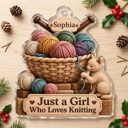 Acrylic ornament shaped around a yarn basket, cat and needles with 'Just a Girl Who Loves Knitting' and a name banner.