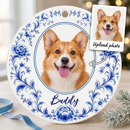 Round ceramic ornament with blue Delft floral border framing a circular photo of a dog and a personalized name.