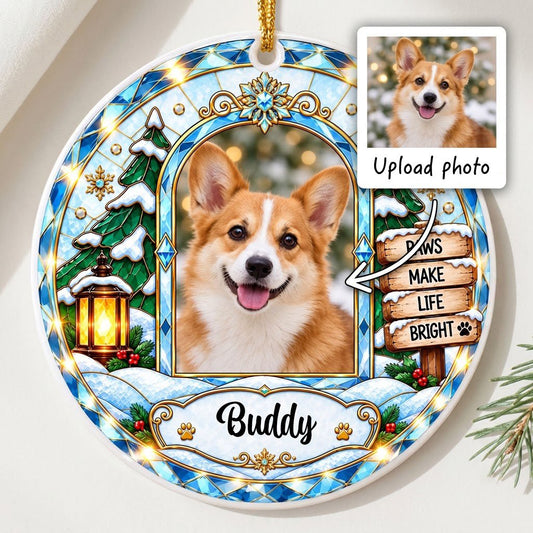 Round ceramic ornament with blue and gold stained-glass border, dog photo center, snow tree, gold lantern, holly, signpo