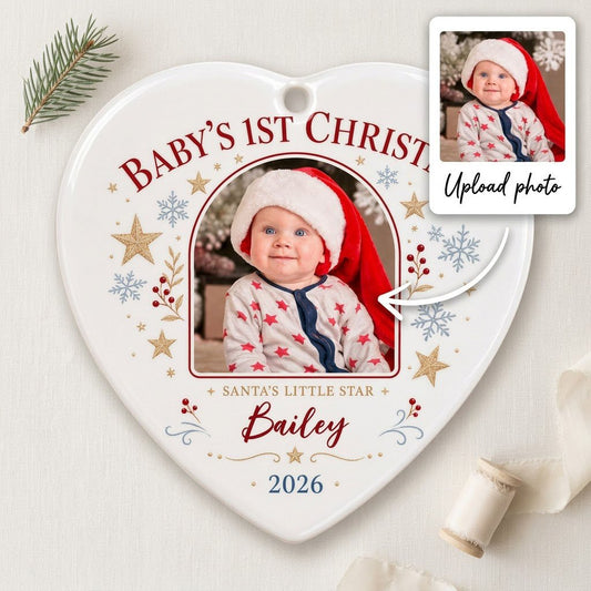 Heart ceramic ornament with arched photo frame, gold stars, blue snowflakes, holly, and 'Baby's 1st Christmas' text.
