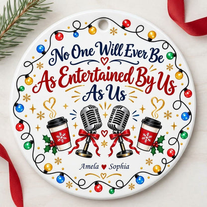 Round ceramic ornament with lights border, two microphones with red bows, and two coffee cups with heart steam.