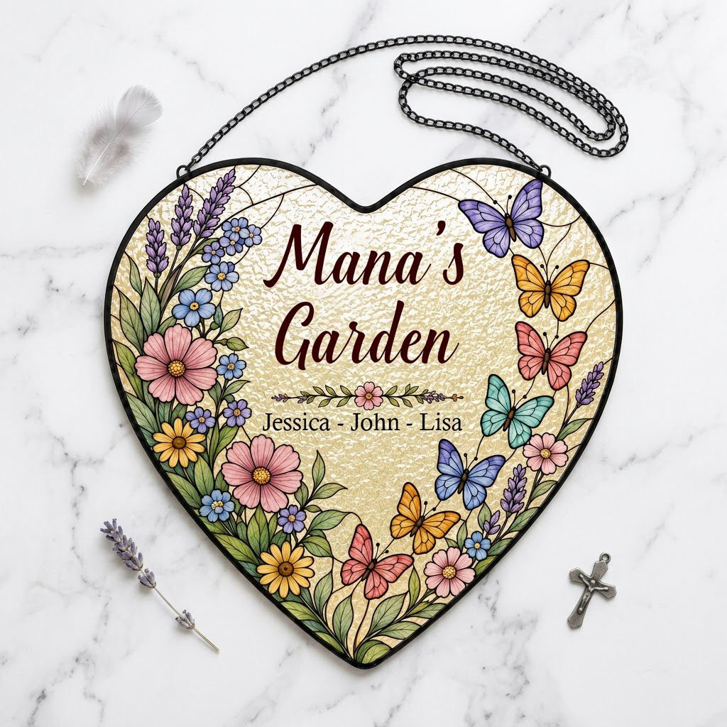Heart stained-glass suncatcher with floral border, colorful butterflies, and 'Mana's Garden' with kids' names.