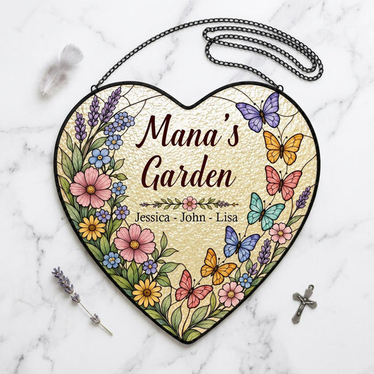 Heart stained-glass suncatcher with floral border, colorful butterflies, and 'Mana's Garden' with kids' names.