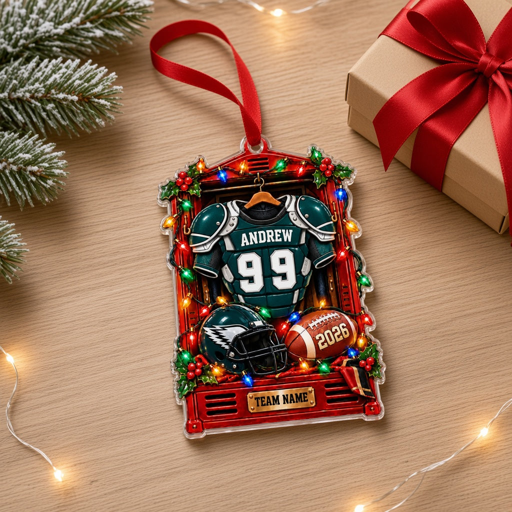 Acrylic ornament of a red football locker with a green jersey, helmet, football, lights and holly for Christmas
