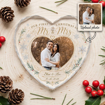 Heart-shaped glass ornament with couple photo, 'Our First Christmas As Mr & Mrs', pine sprigs, berries and gold snowflak