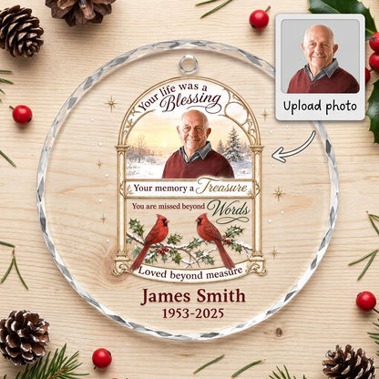 Round glass ornament with golden arched photo frame, two red cardinals on snowy pine and a memorial quote.