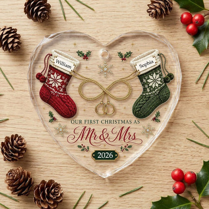 Heart glass ornament with red and green knit stockings, gold infinity loop with rings, Mr & Mrs text, names and date.