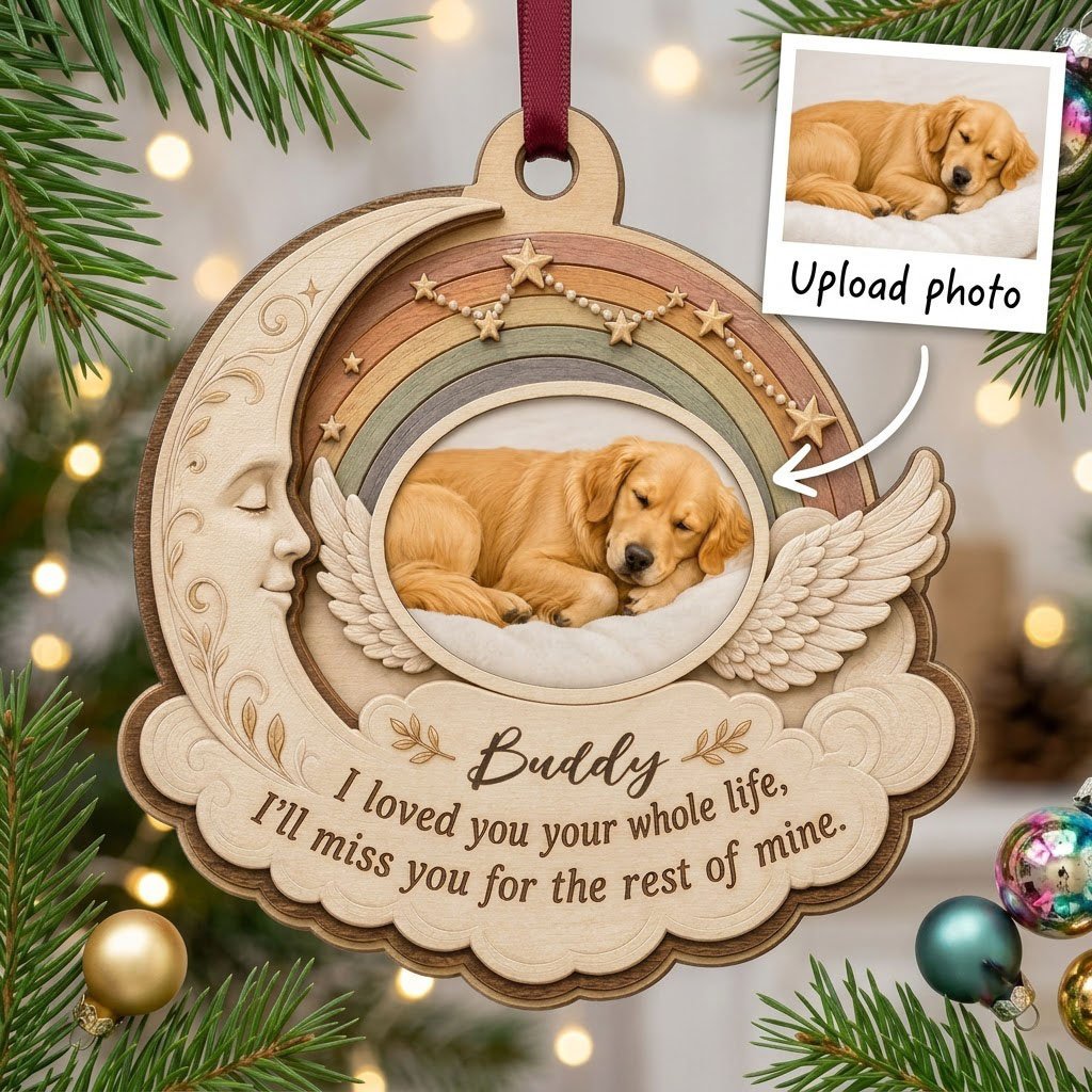 Wood ornament with crescent moon, angel wings, rainbow, and a sleeping dog photo above a cloud plaque.