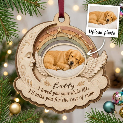 Wood ornament with crescent moon, angel wings, rainbow, and a sleeping dog photo above a cloud plaque.