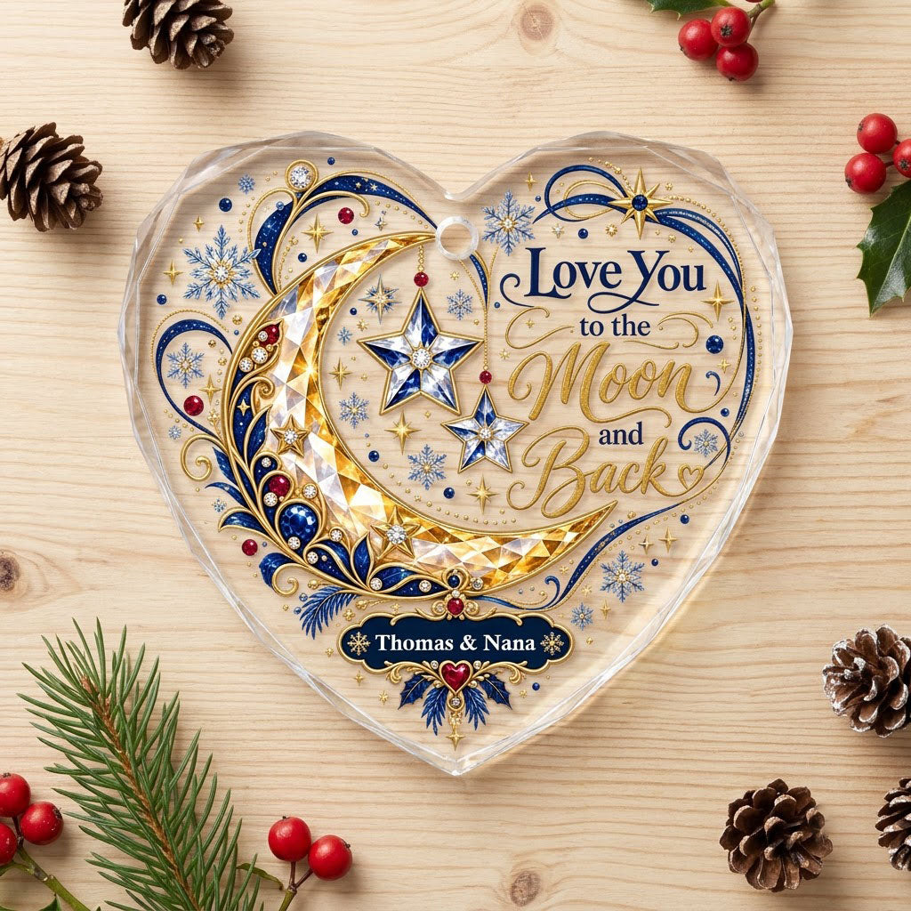 Heart glass ornament with jeweled gold crescent moon, blue hanging stars, and 'Love You to the Moon and Back' text.